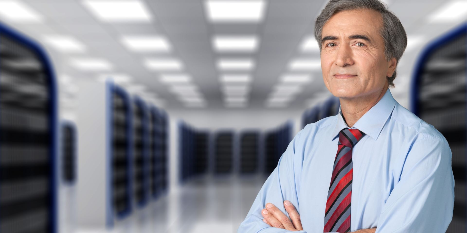 Security auditor in a suit standing in a data center, Microsoft Intune security audit