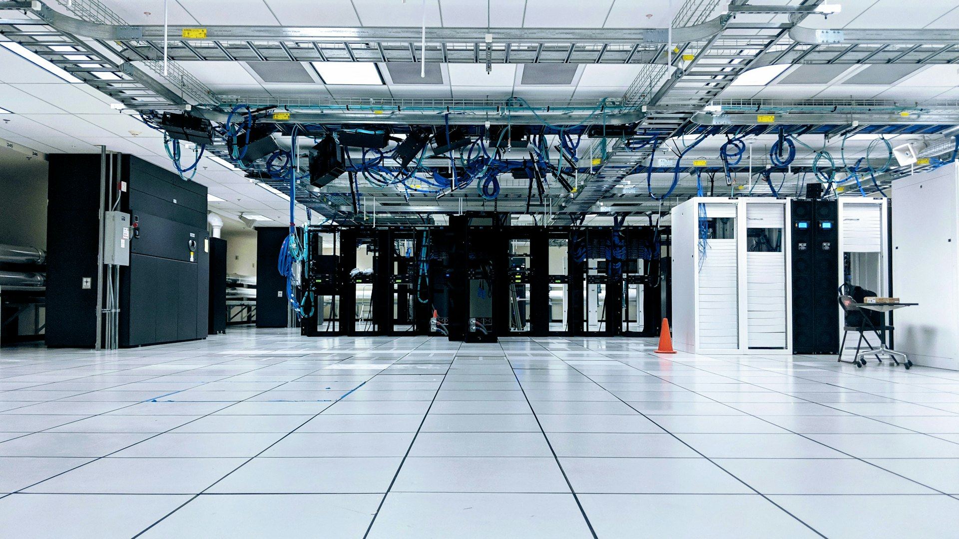 Bright modern data center with rows of server racks