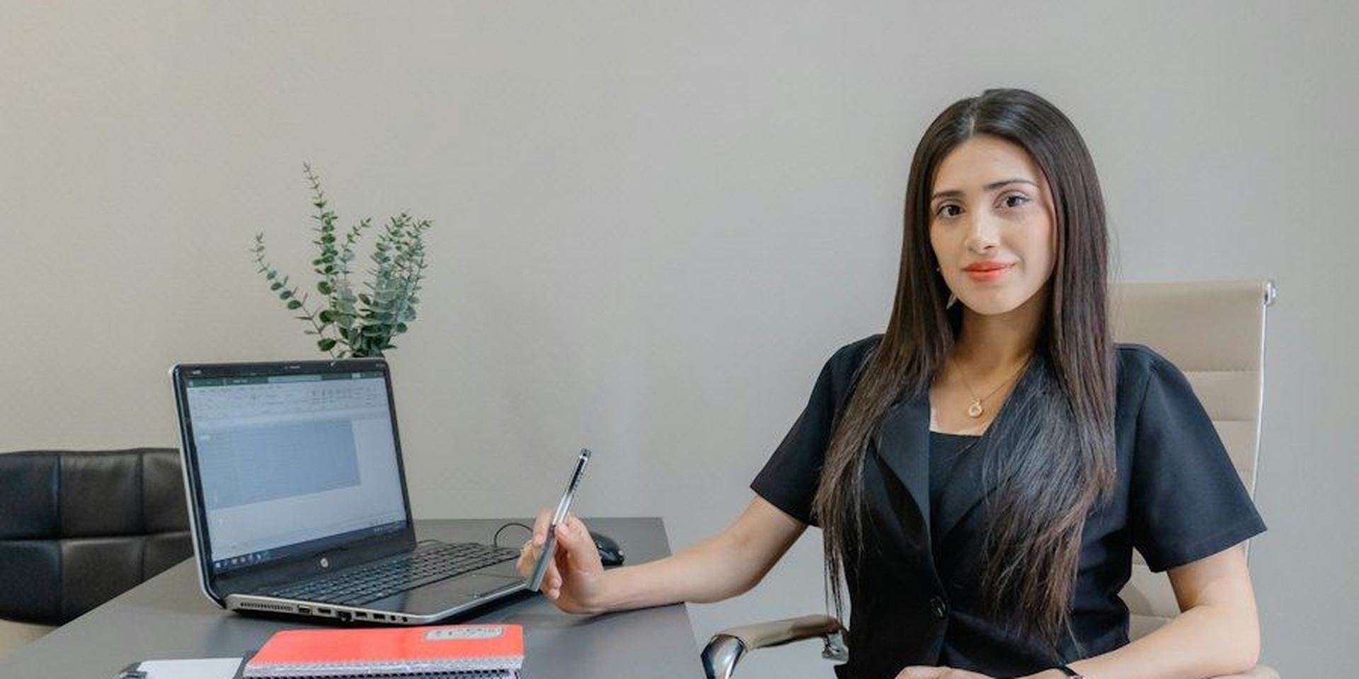 Office professional at her desk reviewing employee privacy obligations