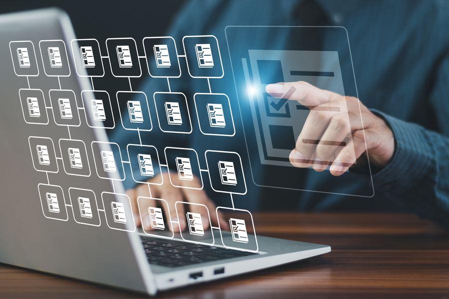 CCPA Cybersecurity Audit: The 18 Components and the 2028 to 2030 Deadlines 5 Reviewer checking documents on a laptop during a cybersecurity audit