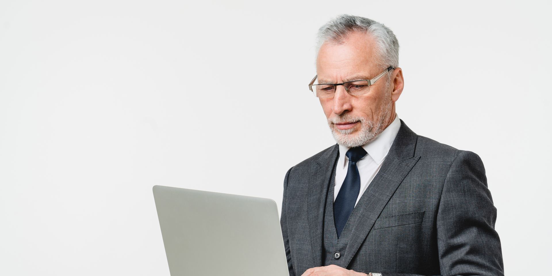 Business executive reviewing CCPA compliance on a laptop