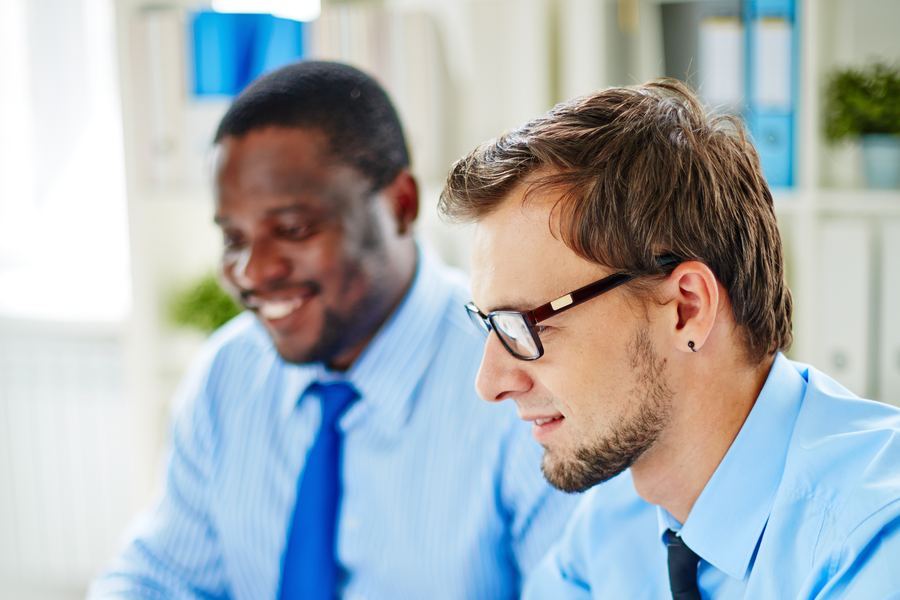 CPA firm professionals reviewing client records on a computer
