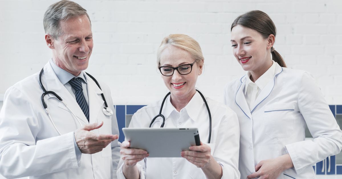 Medical team reviewing patient records on a tablet, illustrating the Change Healthcare ransomware attack